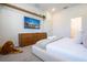 Bedroom with large TV, dresser, and plush bed at 5887 High Seas Dr, Orlando, FL 32821