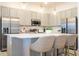 Modern kitchen with stainless steel appliances and white quartz countertops at 5887 High Seas Dr, Orlando, FL 32821