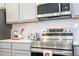 Stainless steel appliances and gray cabinets in this modern kitchen at 5887 High Seas Dr, Orlando, FL 32821