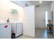 Convenient laundry room with washer, dryer, and shelving at 5887 High Seas Dr, Orlando, FL 32821