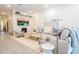 Bright living room featuring a sectional sofa and fireplace at 5887 High Seas Dr, Orlando, FL 32821
