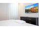 Bedroom with a dresser and large TV on the wall at 5887 High Seas Dr, Orlando, FL 32821