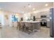 Modern kitchen with gray cabinets, quartz countertops, and island at 5887 High Seas Dr, Orlando, FL 32821