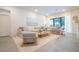 Spacious living room with large sectional sofa and light color scheme at 5887 High Seas Dr, Orlando, FL 32821