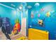 Spongebob-themed bedroom with TV and decor at 5887 High Seas Dr, Orlando, FL 32821