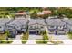 Aerial view of modern homes with a lake and community at 5887 High Seas Dr, Orlando, FL 32821