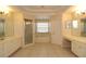 Main bathroom with double vanity, soaking tub and shower at 276 Tavestock Loop, Winter Springs, FL 32708