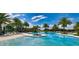 Resort-style pool with palm trees and lounge chairs at 2204 Antilles Club Dr, Kissimmee, FL 34747