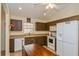 Bright kitchen, featuring dark wood cabinets and a spacious layout at 1740 Efland Ter, Deltona, FL 32738