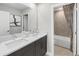 Bathroom with double sinks, a shower/tub combo and linen closet at 12934 Promise Pl, Orlando, FL 32832
