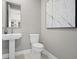 Convenient powder room with pedestal sink and toilet at 12934 Promise Pl, Orlando, FL 32832