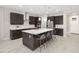 Modern kitchen with large island and stainless steel appliances at 12934 Promise Pl, Orlando, FL 32832