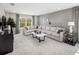 Spacious loft with sectional sofa and a large window at 12934 Promise Pl, Orlando, FL 32832