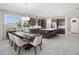 Modern kitchen with island, stainless steel appliances, and dark cabinetry at 12934 Promise Pl, Orlando, FL 32832