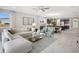 Open concept living room and kitchen with large sectional sofa at 12934 Promise Pl, Orlando, FL 32832