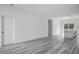 Open living room with gray vinyl plank flooring and an open floor plan at 602 Marion Oaks Blvd, Ocala, FL 34473