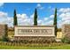 Entrance to Tierra Del Sol community with stone signage at 5639 Costa Blanca Way, Davenport, FL 33897