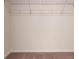 Walk-in closet with wire shelving and a hanging rod at 5639 Costa Blanca Way, Davenport, FL 33897