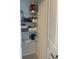 Linen closet with wire shelving, providing ample storage space at 5639 Costa Blanca Way, Davenport, FL 33897