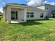 House exterior with backyard and landscaping at 5639 Costa Blanca Way, Davenport, FL 33897