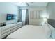 Bedroom with a king-size bed and modern dresser at 7432 Marker Ave, Kissimmee, FL 34747