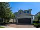 Two-story house with brown garage door and brick paver driveway at 7432 Marker Ave, Kissimmee, FL 34747