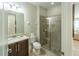 Clean bathroom with shower and granite vanity at 7432 Marker Ave, Kissimmee, FL 34747
