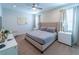 Spacious bedroom with a king-size bed and en-suite bathroom at 7432 Marker Ave, Kissimmee, FL 34747