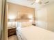 Cozy bedroom with a queen bed and en-suite bathroom at 7432 Marker Ave, Kissimmee, FL 34747