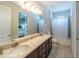 Bathroom with double vanity, shower, and bathtub at 7432 Marker Ave, Kissimmee, FL 34747