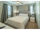 Bright bedroom with ceiling fan and ensuite bathroom at 7432 Marker Ave, Kissimmee, FL 34747