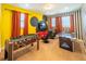 Fun game room with foosball, air hockey, and TV at 7432 Marker Ave, Kissimmee, FL 34747