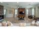 Spacious living room with light beige sofa and large TV at 7432 Marker Ave, Kissimmee, FL 34747