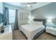 Bedroom with a king-size bed and modern dresser at 7432 Marker Ave, Kissimmee, FL 34747