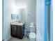 Clean bathroom with granite vanity and toilet at 7432 Marker Ave, Kissimmee, FL 34747