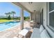 Relaxing pool area with covered patio, seating, and hot tub at 7432 Marker Ave, Kissimmee, FL 34747