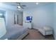 Bright bedroom with a king-size bed and a sitting area at 7432 Marker Ave, Kissimmee, FL 34747