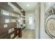 Bright entryway with wood-look wall and glass-top console table at 7432 Marker Ave, Kissimmee, FL 34747