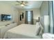 Comfortable bedroom with TV and ensuite bathroom at 7432 Marker Ave, Kissimmee, FL 34747