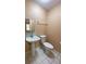 Simple half bathroom with pedestal sink and toilet at 608 N Summerlin Ave, Orlando, FL 32803