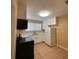 Updated kitchen with white cabinets and black appliances at 608 N Summerlin Ave, Orlando, FL 32803