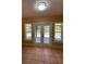 Sunroom with tile floors and French doors to backyard at 608 N Summerlin Ave, Orlando, FL 32803