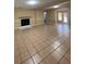 Living area with tile flooring, fireplace and access to patio at 608 N Summerlin Ave, Orlando, FL 32803