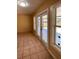 Sunroom with tile floor and French doors leading to a deck at 608 N Summerlin Ave, Orlando, FL 32803