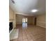 Spacious living room with tile floors and fireplace at 608 N Summerlin Ave, Orlando, FL 32803