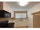 Modern kitchen with white cabinets and black appliances at 608 N Summerlin Ave, Orlando, FL 32803