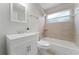 Clean bathroom with white vanity, tub, and tile at 4704 Cheyenne Point Trl, Kissimmee, FL 34746