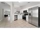 Modern kitchen featuring stainless steel appliances and white cabinets at 4704 Cheyenne Point Trl, Kissimmee, FL 34746