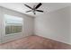 Bright bedroom with window, ceiling fan, and carpet at 4704 Cheyenne Point Trl, Kissimmee, FL 34746