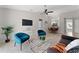 Spacious living area with seating and views into dining area at 4704 Cheyenne Point Trl, Kissimmee, FL 34746